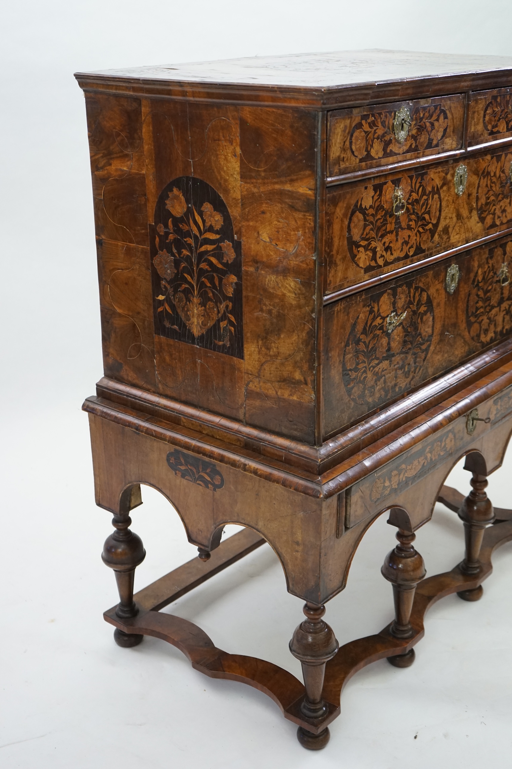 A William and Mary walnut and marquetry chest on stand